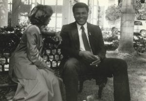 Tanya Hart and Muhammad Ali sitting on a bench